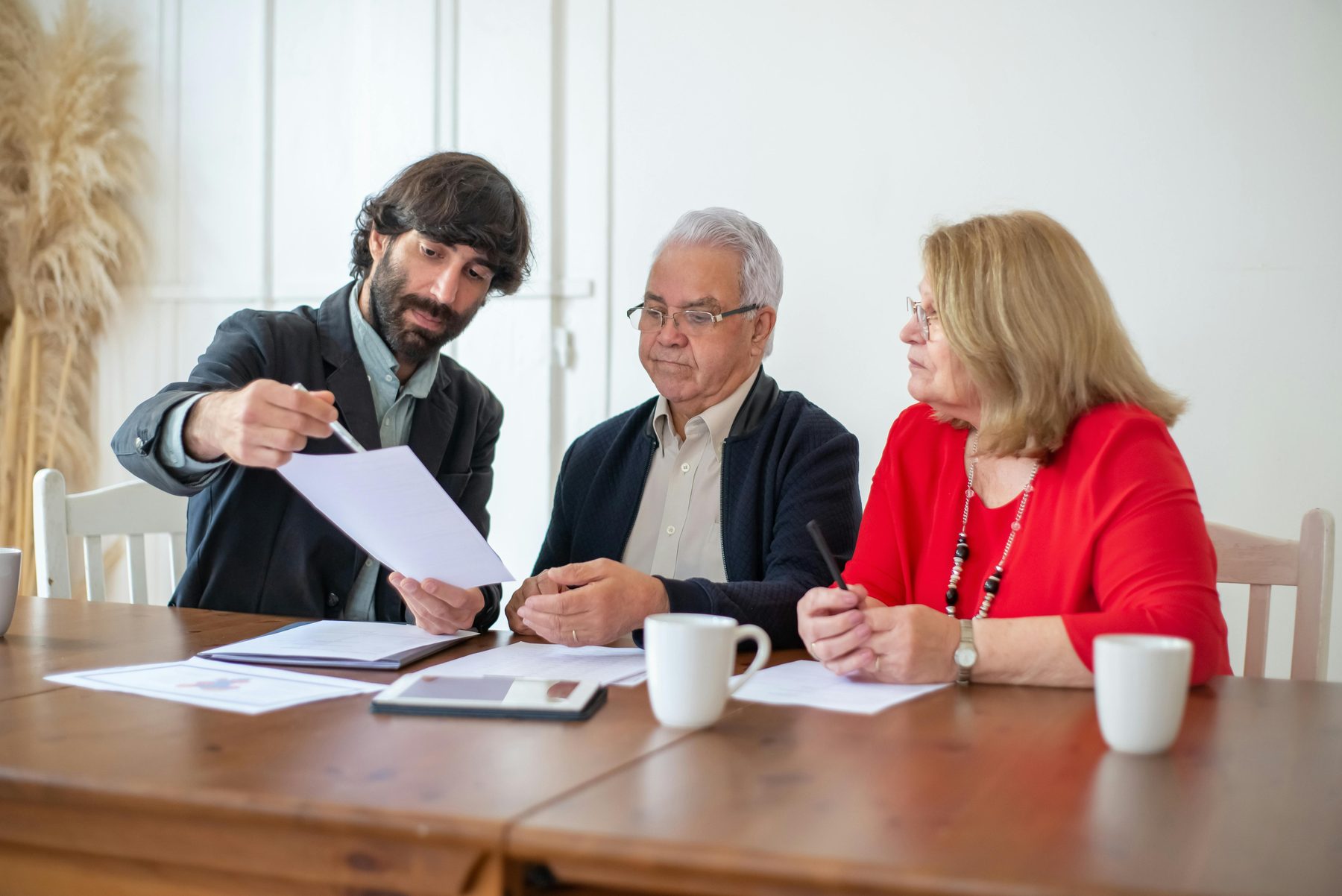 A retired couple reviewing Medicare-related planning documents together