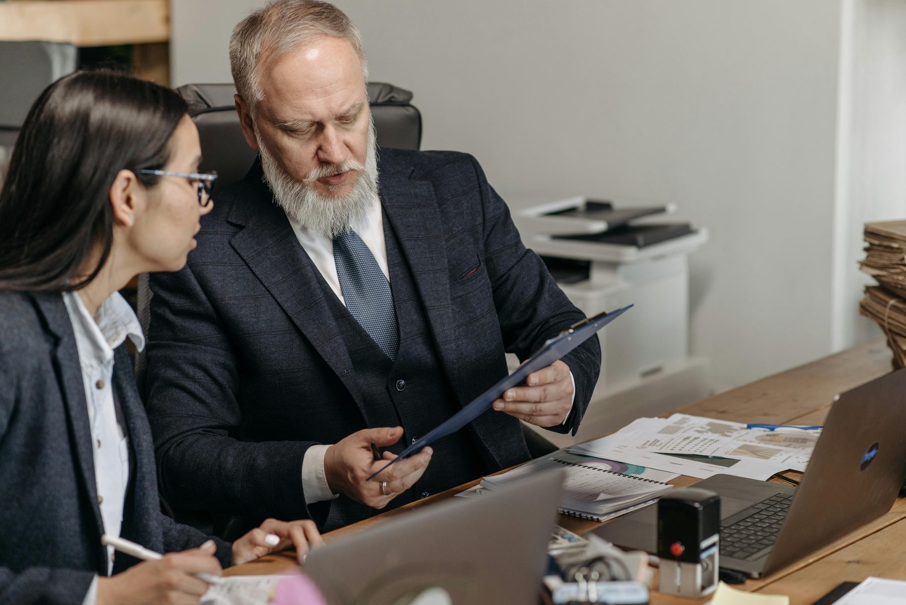 An advisor meeting with clients to review retirement income planning decisions