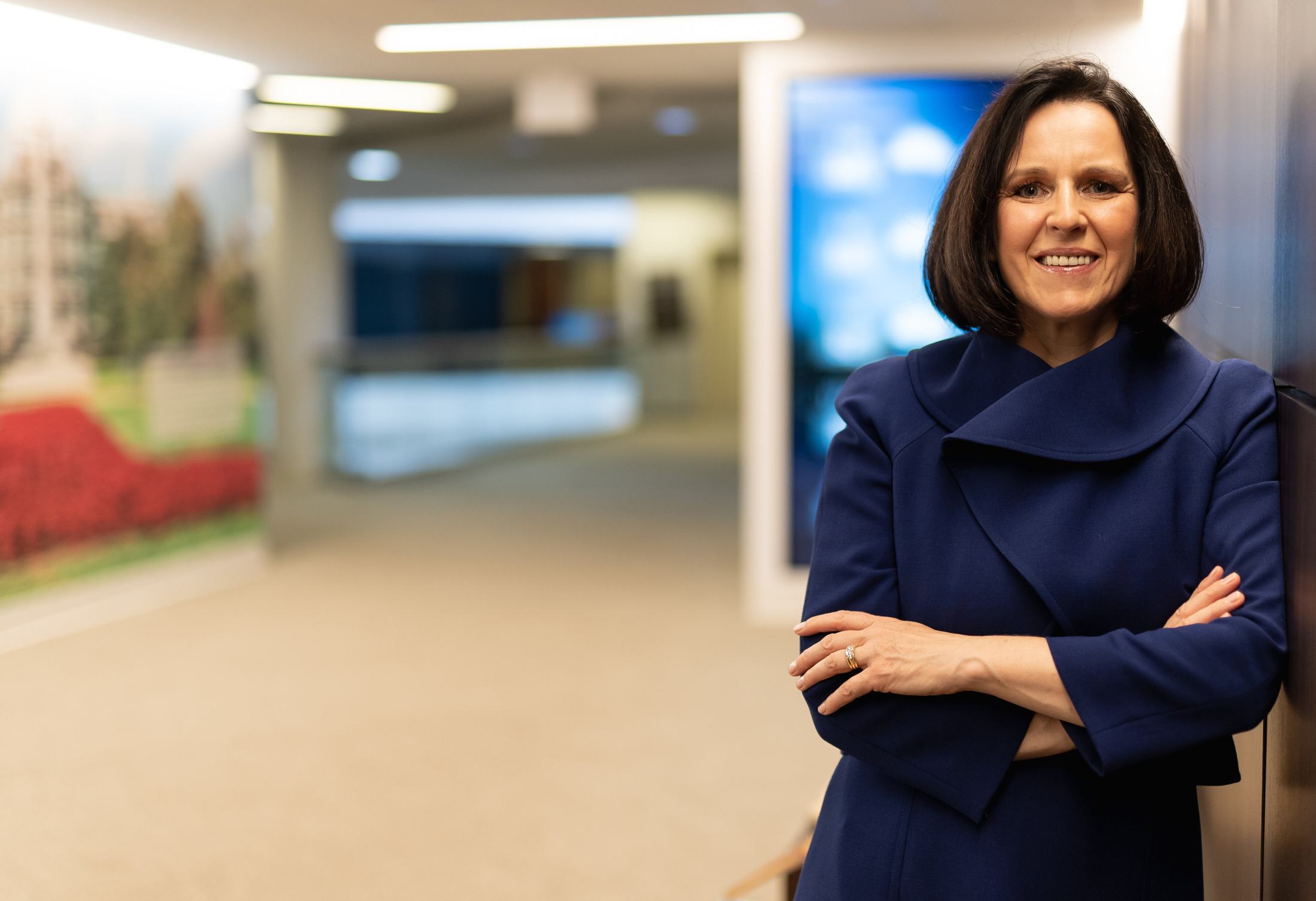 Asta Sanders in a professional office setting