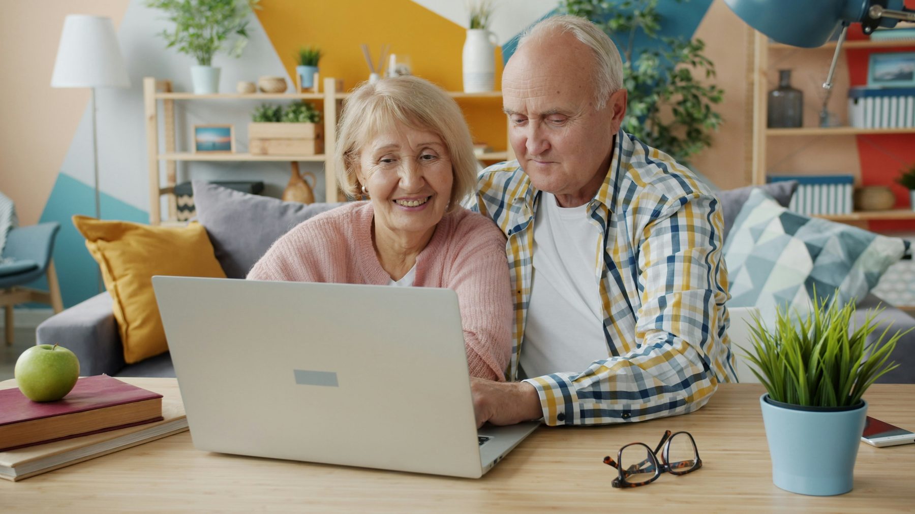 A couple reviewing retirement planning decisions together at a table